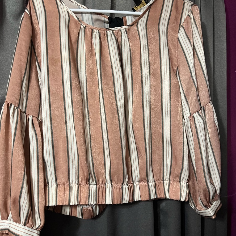 Pink striped blouse with black bow